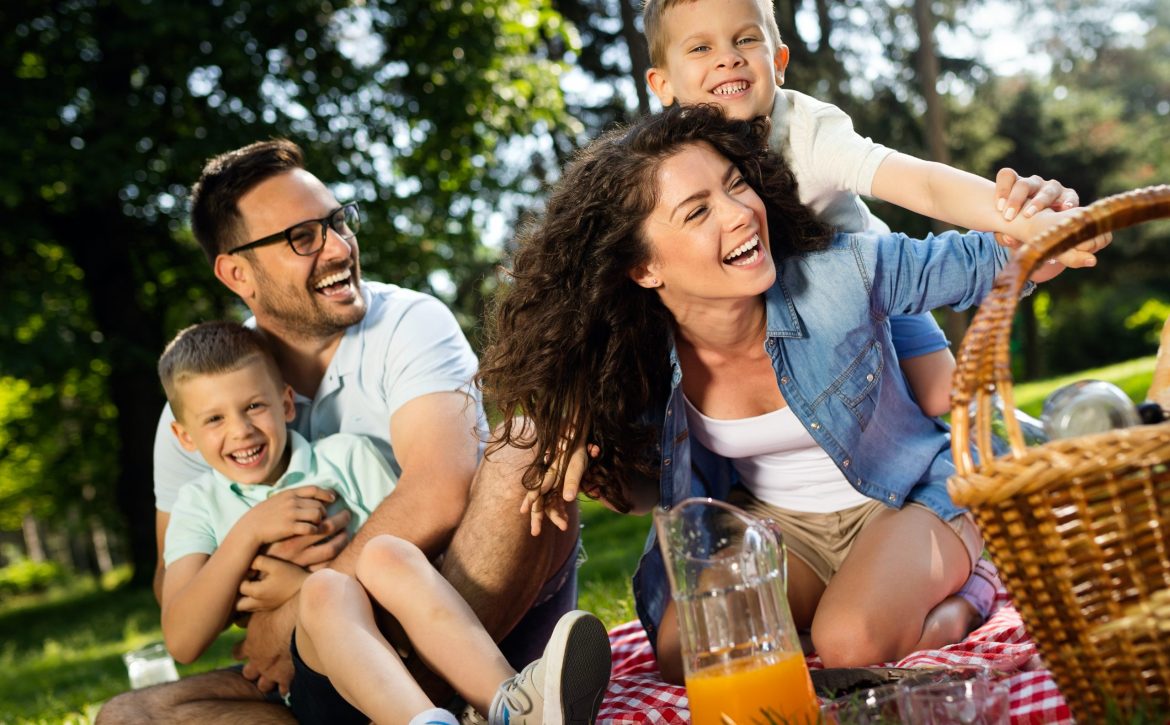 Cheerful happy family picnicking on a beautiful day