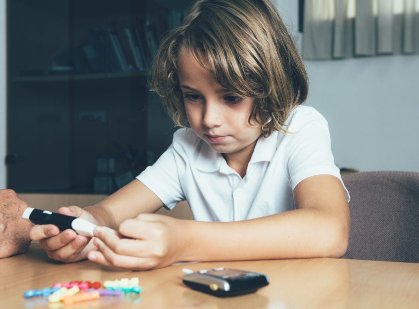 Diabetic child makes a lancing