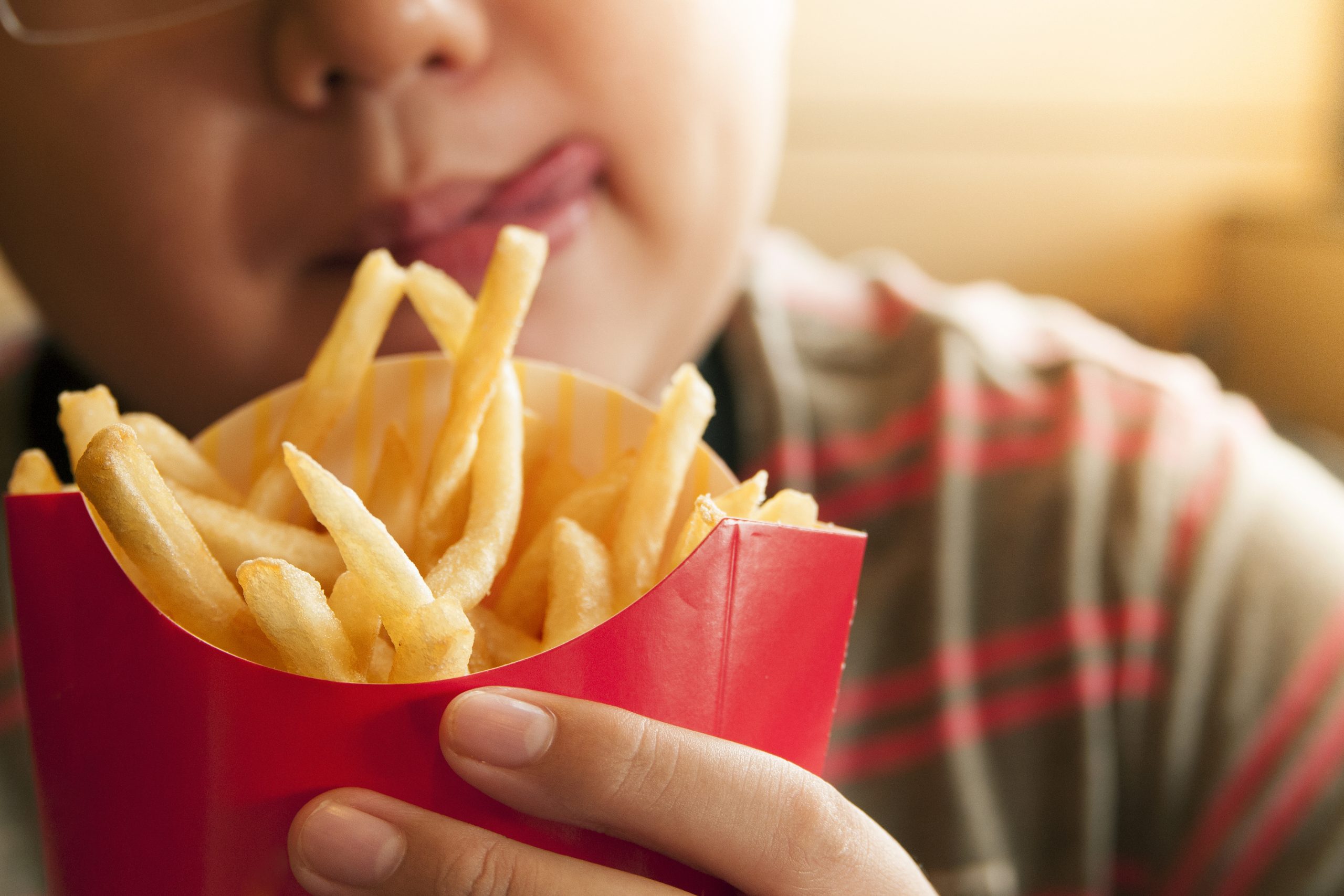 Kid Holding French Fries Packet